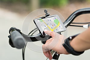 Finger Pointing At Smart Phone Showing GPS Navigation