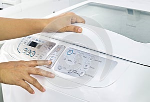 Finger press button start on white washing machine