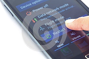 Finger press Restart button on smartphone