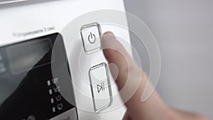 Finger press the switch to make the washing machine work. Home appliances