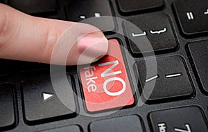 Finger presses No fake button on laptop keyboard