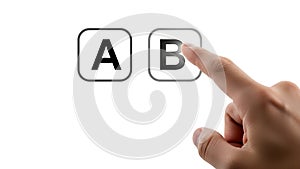 Finger pressing button B next to button A, A B Testing, choice, decision, selection, comparison, concept