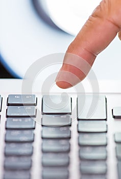 Finger on pressing keyboard
