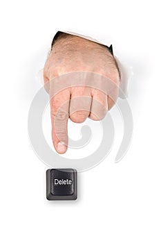 Finger pushing delete key.