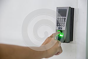 Finger scan on machine Security concept and safety. soft focus on hand scanning finger on machine concept. Businessman hand scanni
