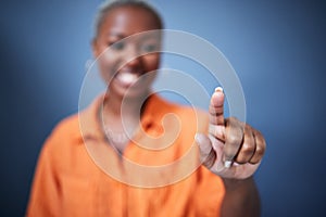 Finger, security and black woman user in studio on blue background for internet browsing or access to information