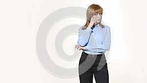 Finger to his temple. decision and skepticism. girl in pants and blous. Isolated on white background. body language