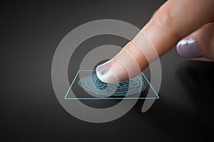 Finger touching black interactive panel