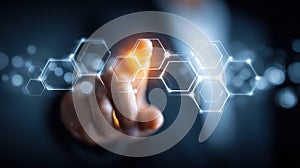 A finger touching a digital hexagonal interface, representing network technology.