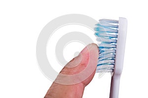 Finger touching soft and slim tapered toothbrush bristle photo