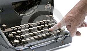 Finger on a type writer key