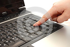 Finger typing on laptop