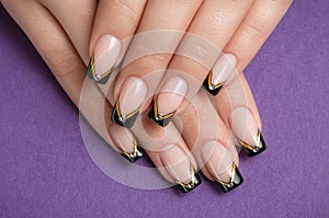Fingernails with black french manicure photo
