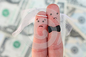 Fingers art of couple on background of money. Concept of wedding, woman and man needs to get married, but they don`t want.