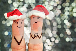Fingers art of couple celebrates Christmas.