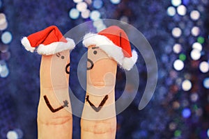 Fingers art of couple celebrates Christmas.