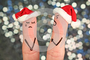 Fingers art of couple celebrates Christmas. Concept of man and woman during quarre