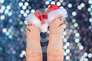 Fingers art of couple celebrates Christmas. Concept of man and woman during quarrel in New Year.