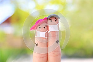 Fingers art of couple with face mask on walk