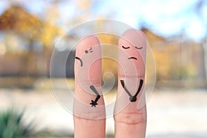 Fingers art of displeased couple. Woman was offended, man was guilty photo