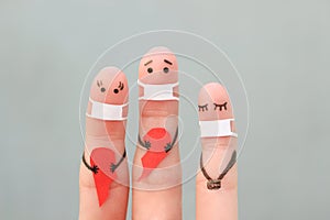 Fingers art of family in medical mask from COVID-2019. Concept of couple holding broken heart