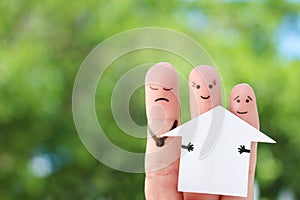 Fingers art of family during quarrel. Concept of man and woman divide house after divorce