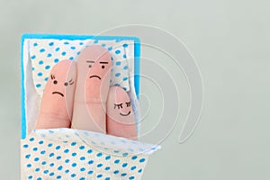 Fingers art of  family sleep together. Concept of child prevents parents from sleeping