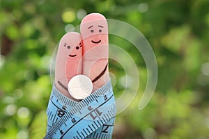 Fingers art of Happy couple. The concept of a man and a woman on the pill