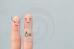 Fingers art of Happy couple. Man likes women`s long eyelashes