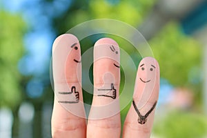 Fingers art of happy family. Concept parents are proud of their child