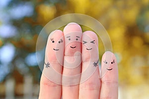 Fingers art of happy family.  The concept of a walk in the autumn park