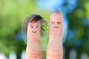 Fingers art of people. One woman is upset because she doesn`t have much hair