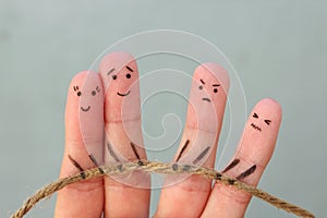 Fingers art of people. They playing tug of war