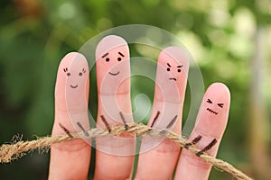 Fingers art of people playing tug of war with rope