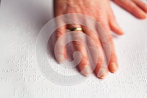 Fingers and Braille. Blind read.