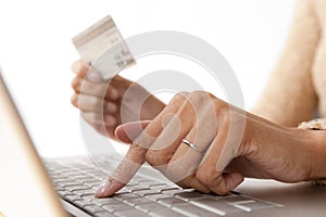Fingers on Computer with Credit Card