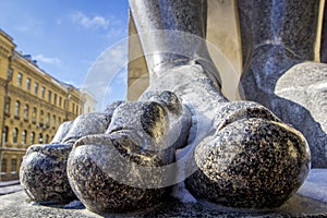 Fingers on the feet of Atlant`s statues that hold the ceiling of the New Hermitage, St. Petersburg, Russia