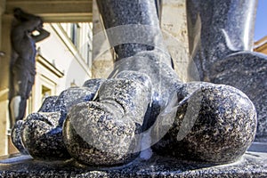 Fingers on the feet of Atlant`s statues that hold the ceiling of the New Hermitage, St. Petersburg, Russia