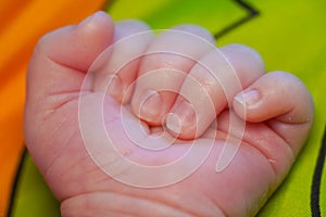 Fingers on hand with the nails of a newborn baby. close up view macro closeup