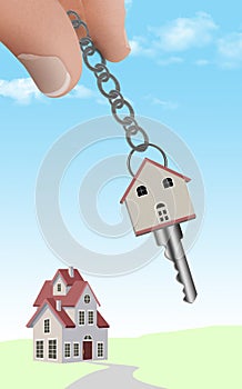 Fingers hold a keychain with a key shaped like a house.