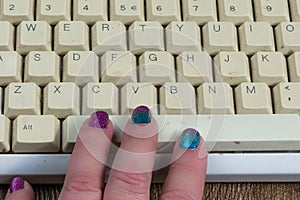 Fingers on keyboard spacebar photo