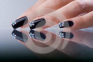 Fingers with original design manicure