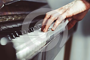 Fingers on the piano photo