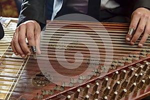 Fingers Playing Arabian Qanon Musical Instrument photo