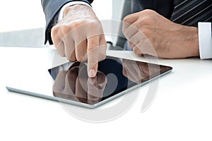 Fingers touching tablet computer