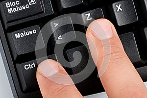 Fingers Typing Undo Command on Keyboard