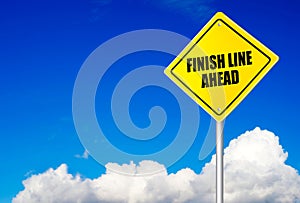 Finish line ahead message on road sign photo