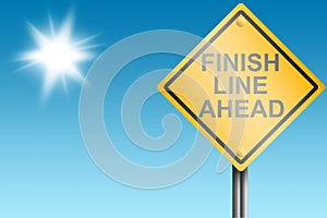 Finish line ahead street sign with blue sky