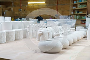Finished plaster products: vases, figurines, bowls. Making and casting decorative dishes and vases from plaster for home