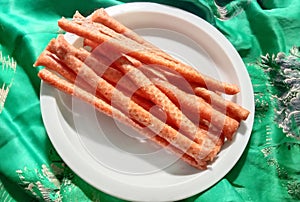 finished pork sticks placed on a white background